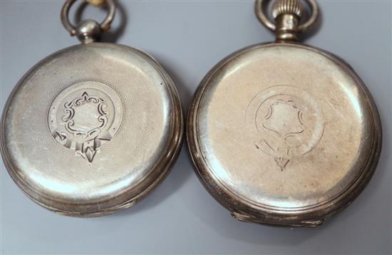 A cased pair of silver napkin rings, a silver pill box and spoon, a silver vesta case and two silver pocket watches.